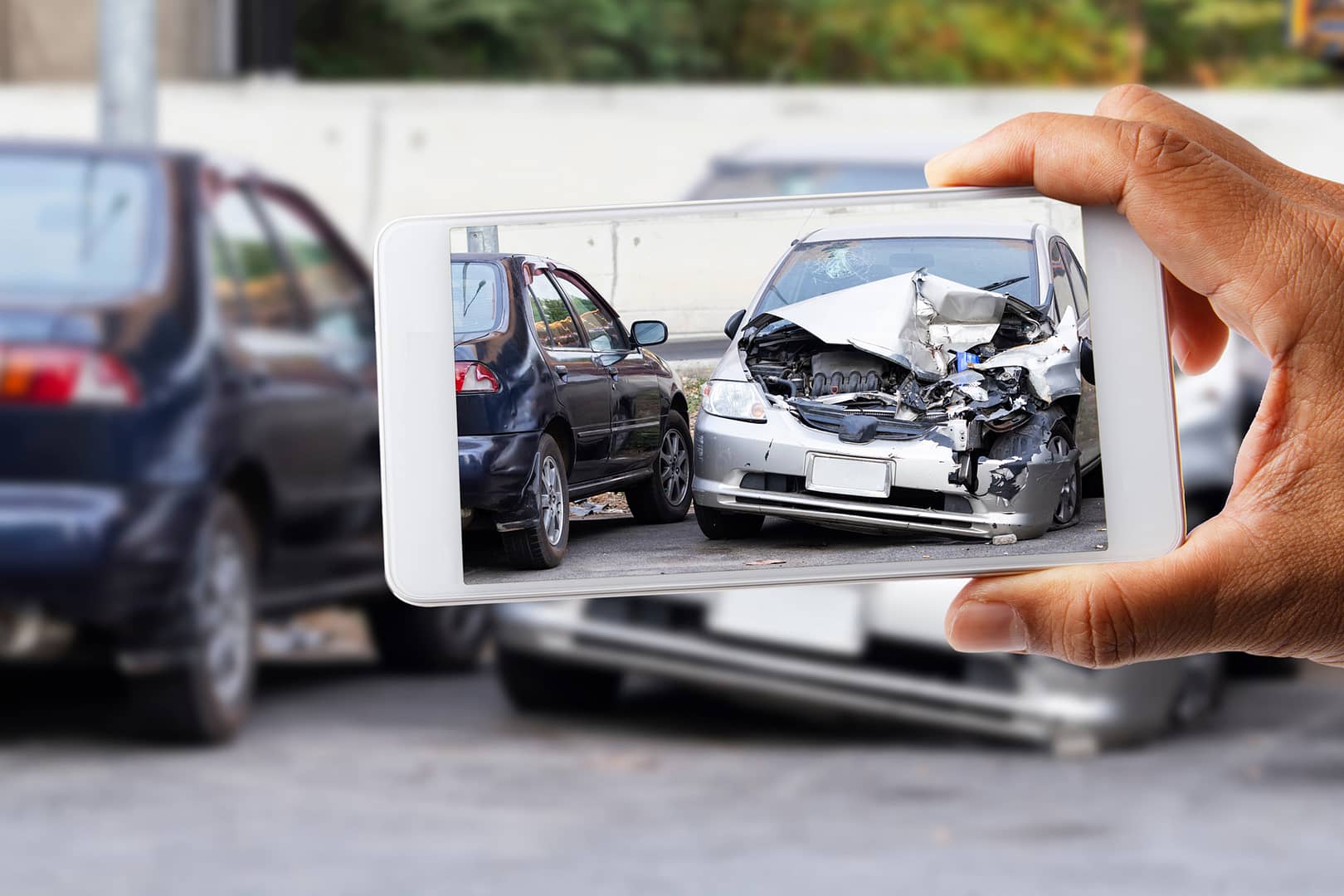 Photo of car accident on road. How to Determine Who is at Fault in a Texas Car Accident