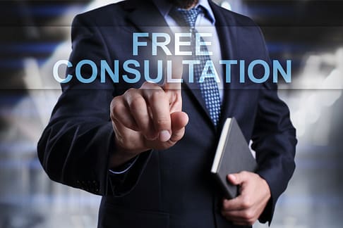 Businessman is pressing on virtual screen and selecting Free consultation - Small Claims Court for Auto Accidents in Texas