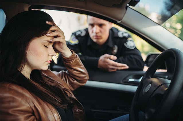 Woman pulled over by the police. Do Police Check for Warrants When Pulling You Over?