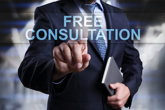 Businessman is pressing on virtual screen and selecting Free consultation. Texas public transit accident lawyers.
