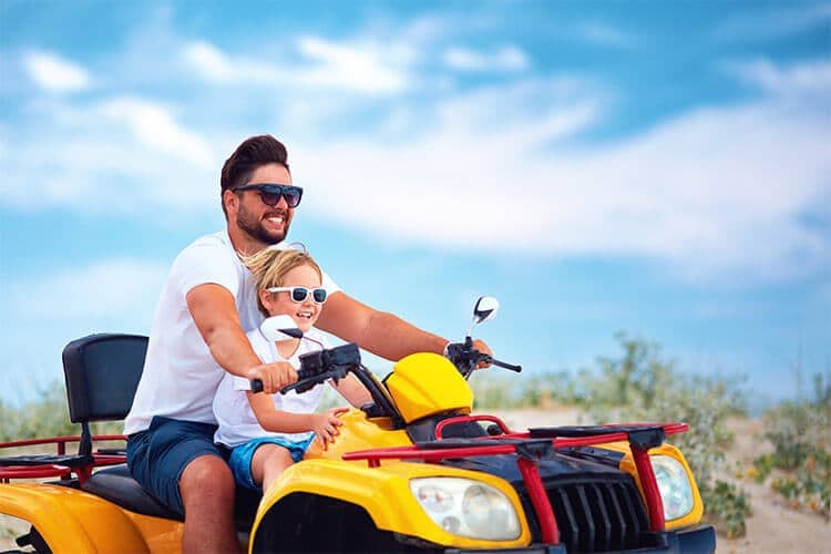 Father and son on an ATV - ATV accident lawyers