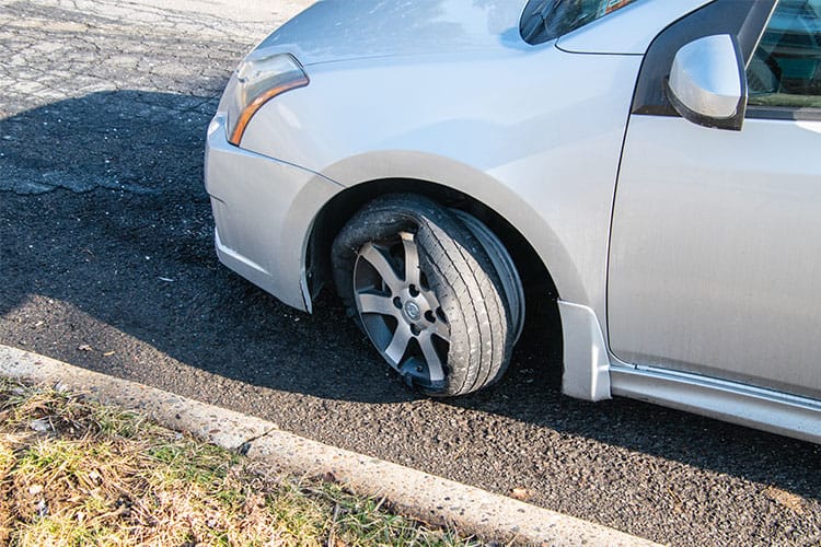 winter car safety checklist flat tire