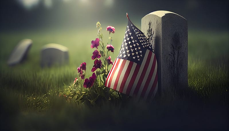 American flag laying on grave at the peaceful flowers. Arlington Wrongful Death Lawyer. McKinney Wrongful Death Lawyer. 