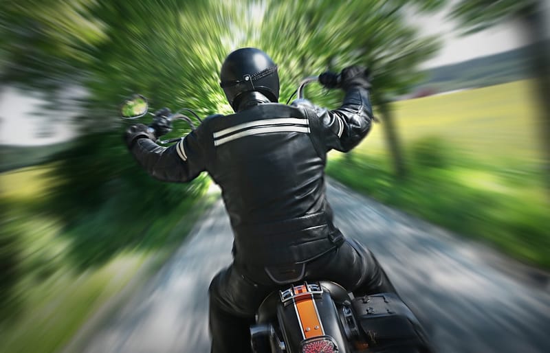 View of man driving a motorcycle from behind - Lubbock Motorcycle Accident Lawyers