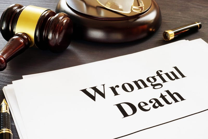 Wrongful Death report and gavel in a court. Denton Wrongful Death Lawyer