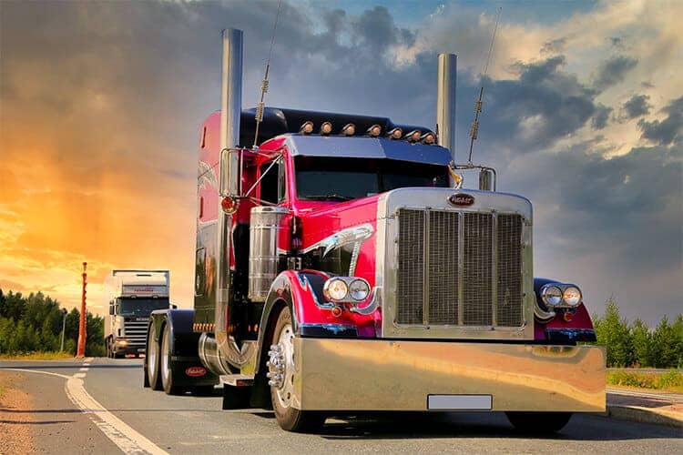 Large semi-truck with sunset in the background - Austin Truck Accident Lawyers