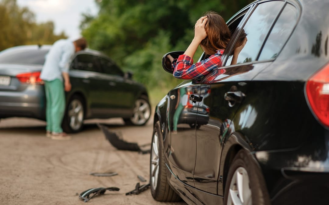 Male and female drivers after car accident on road. Automobile crash. Broken automobile or damaged vehicle, auto collision on highway. Car accident in new mexico
